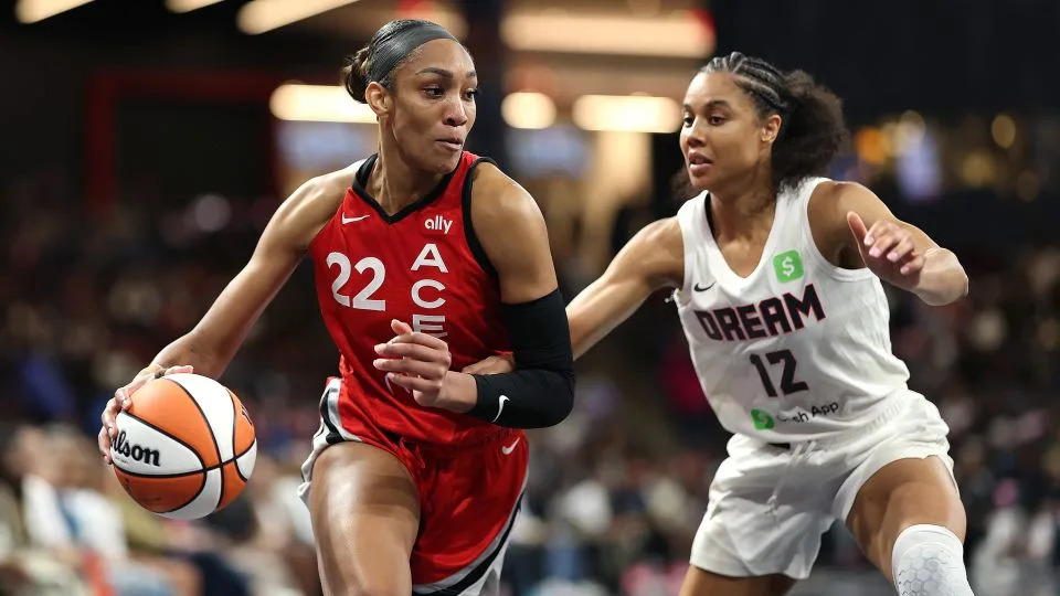 A'ja Wilson drives against Atlanta Dream forward Nia Coffey on August 27. - Kevin C. Cox/Getty Images