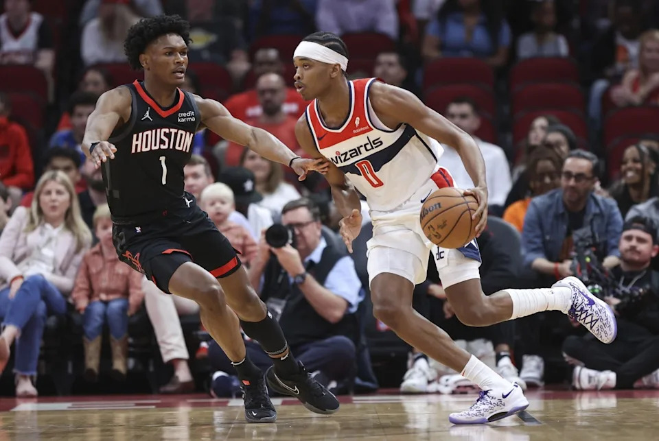 Washington Wizards guard Bilal Coulibaly (0) dribbles the ball as Houston Rockets forward Amen Thompson (1) Troy Taormina-Imagn Images