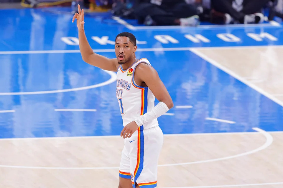 Jun 16, 2025; Oklahoma City, Oklahoma, USA; Oklahoma City Thunder guard Aaron Wiggins (21) celibates making a three point basket against the Indiana Pacers during the second quarter in game five of the 2025 NBA Finals at Paycom Center. Mandatory Credit: Alonzo Adams-Imagn Images