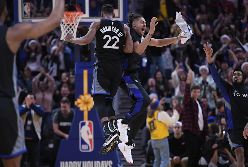 SAN FRANCISCO, CALIFORNIA - DECEMBER 25: Glenn Robinson III #22 and Jordan Poole #3 of the Golden State Warriors celebrates after Robinson III made a three-point shot against the Houston Rockets during the second half of an NBA basketball game at Chase Center on December 25, 2019 in San Francisco, California. NOTE TO USER: User expressly acknowledges and agrees that, by downloading and or using this photograph, User is consenting to the terms and conditions of the Getty Images License Agreement. (Photo by Thearon W. Henderson/Getty Images)