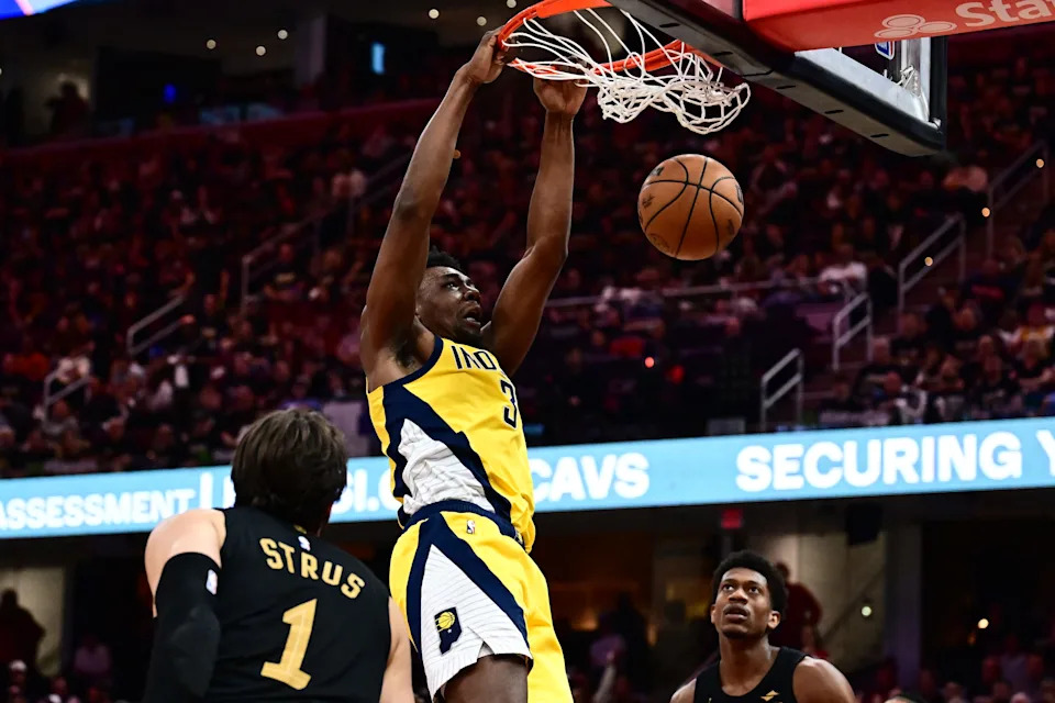 May 13, 2025; Cleveland, Ohio, USA; Indiana Pacers center Thomas Bryant (3) dunks as Cleveland Cavaliers guard Max Strus (1) defends during the second half of game five of the second round for the 2025 NBA Playoffs at Rocket Arena. Mandatory Credit: Ken Blaze-Imagn Images