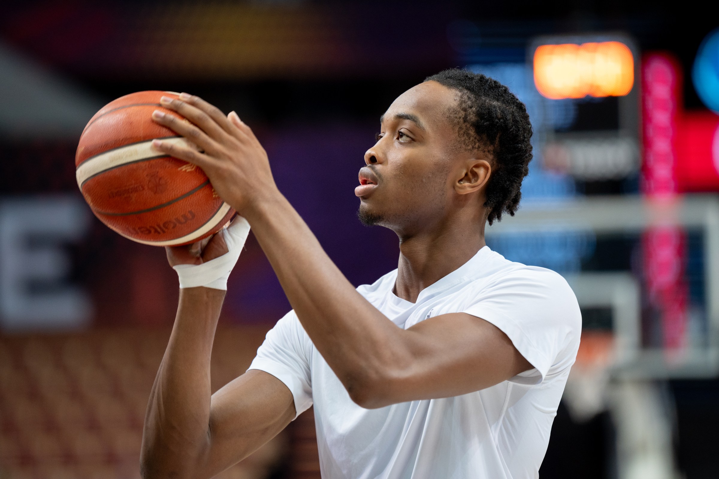 Bilal Coulibaly before a EuroBasket game with tape on his injured thumb.