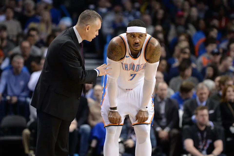 Dec 22, 2017; Oklahoma City, OK, USA; Oklahoma City Thunder head coach Billy Donovan (L) speaks to Oklahoma City Thunder forward Carmelo Anthony (7) in a break in action against the Atlanta Hawks during the first quarter at Chesapeake Energy Arena. Mandatory Credit: Mark D. Smith-USA TODAY Sports