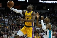 Los Angeles Lakers' D'Moi Hodge shoots over Charlotte Hornets' Brandon Miller during the...