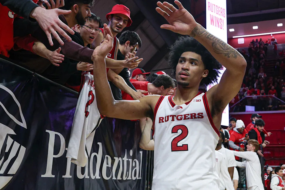 Rutgers guard Dylan Harper slaps hands with fans after a game at Jersey Mike's Arena. Mandatory Credit: Vincent Carchietta-Imagn Images
