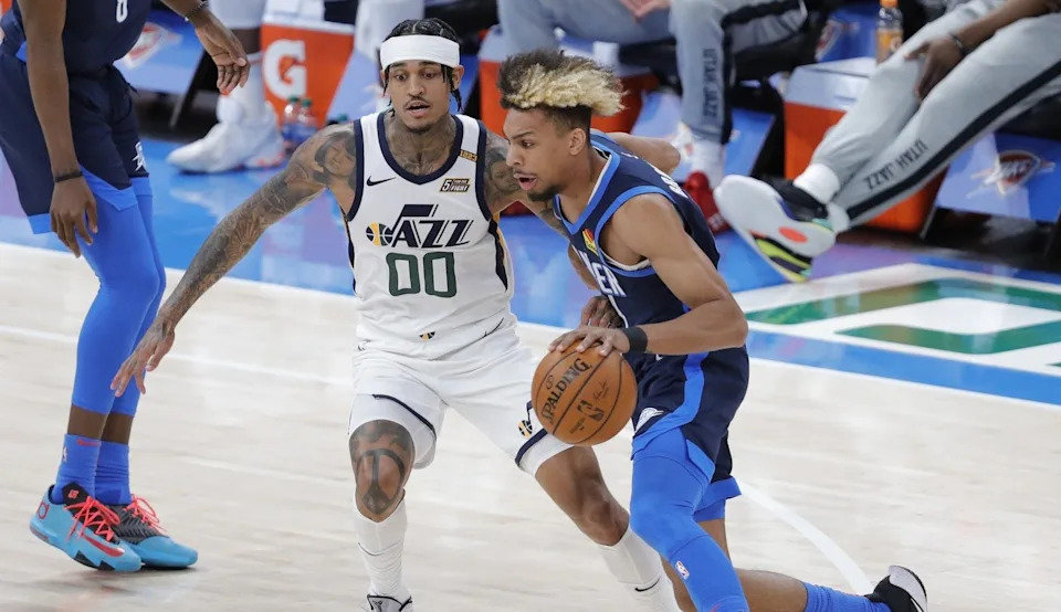 May 14, 2021; Oklahoma City, Oklahoma, USA; Oklahoma City Thunder forward Charlie Brown Jr. (44) drives to the basket around Utah Jazz guard Jordan Clarkson (00) during the first quarter at Chesapeake Energy Arena. Alonzo Adams-USA TODAY Sports