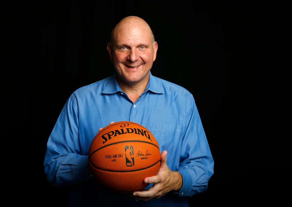 Steve Ballmer, owner of the Los Angeles Clippers, holding a basketball.