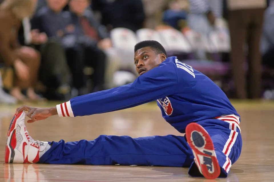 LOS ANGELES - 1990: Dennis Hopson #2 of the New Jersey Nets stretches before the NBA game against the Los Angeles Lakers at the Great Western Forum in Los Angeles, California in 1990. NOTE TO USER: User expressly acknowledges and agrees that, by downloading and/or using this Photograph, User is consenting to the terms and conditions of the Getty Images License Agreement. Mandatory copyright notice : Copyright 1990 NBAE. (Photo by Ken Levine /Getty Images)