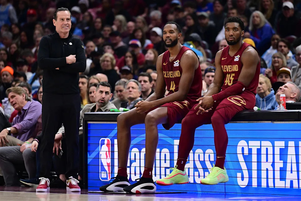 Cavaliers forward Evan Mobley (4) and guard Donovan Mitchell (45) wait along side head coach Kenny Atkinson to enter the game during the first half against the New York Knicks, April 2, 2025, in Cleveland.