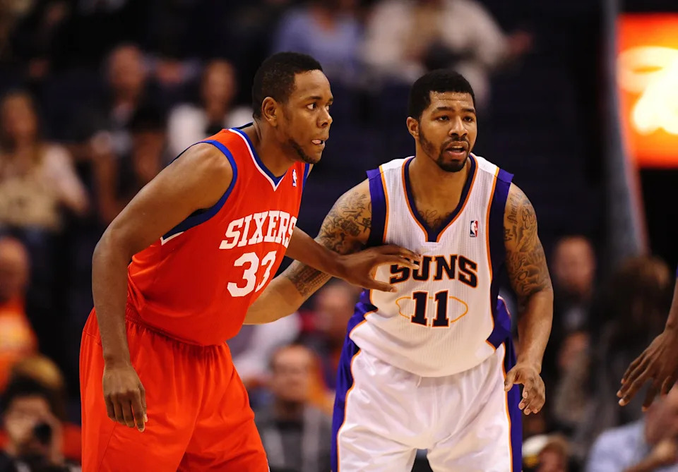 Dec. 28, 2011; Phoenix, AZ, USA; Philadelphia 76ers forward Craig Brackins (left) alongside Phoenix Suns forward Markieff Morris at the US Airways Center. The 76ers defeated the Suns 103-83. Mandatory Credit: Mark J. Rebilas-USA TODAY Sports