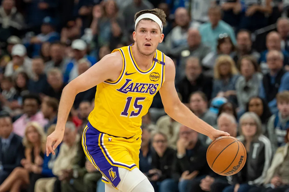 Apr 25, 2025; Minneapolis, Minnesota, USA; Los Angeles Lakers guard Austin Reaves (15) dribbles the ball against the Minnesota Timberwolves during game three of first round for the 2024 NBA Playoffs at Target Center. Mandatory Credit: Jesse Johnson-Imagn Images