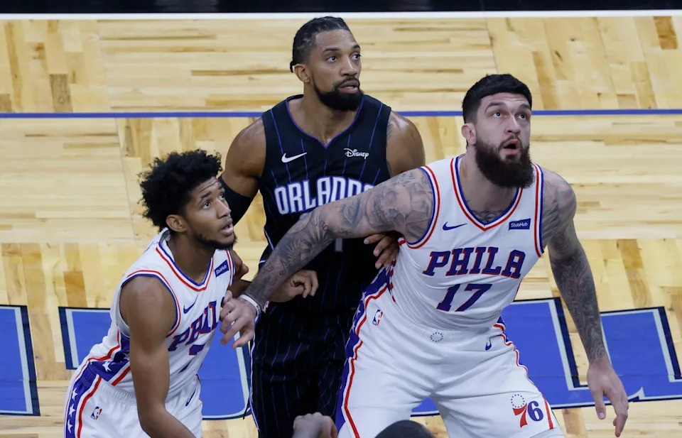 Dec 31, 2020; Orlando, Florida, USA; Orlando Magic center Khem Birch (24) battles for the rebound with Philadelphia 76ers guard Isaiah Joe (7) and center Vincent Poirier (17) during the fourth quarter at Amway Center. Mandatory Credit: Reinhold Matay-USA TODAY Sports