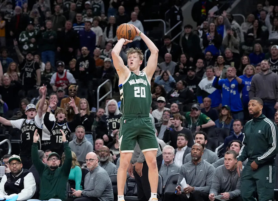 Apr 8, 2025; Milwaukee, Wisconsin, USA; Milwaukee Bucks guard AJ Green (20) makes a three point shot against the Minnesota Timberwolves in the second half at Fiserv Forum. Mandatory Credit: Michael McLoone-Imagn Images