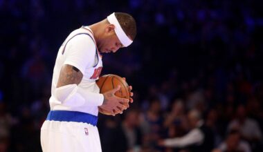USA forward Carmelo Anthony (15) high fives teammates against Sweden during the men's basketball semifinal match