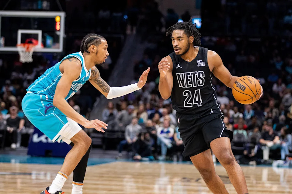 Mar 8, 2025; Charlotte, North Carolina, USA; Brooklyn Nets guard Cam Thomas (24) drives on Charlotte Hornets guard Nick Smith Jr. (8) during the second quarter at Spectrum Center. Mandatory Credit: Scott Kinser-Imagn Images
