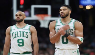 Boston Celtics' Jayson Tatum (0), right, reacts beside Derrick White after falling on a flagrant fowl by Orlando Magic's Kentavious Caldwell-Pope during the second half in Game 1 of a first-round NBA playoff basketball series Sunday, April 20, 2025, in Boston. (AP Photo/Michael Dwyer)