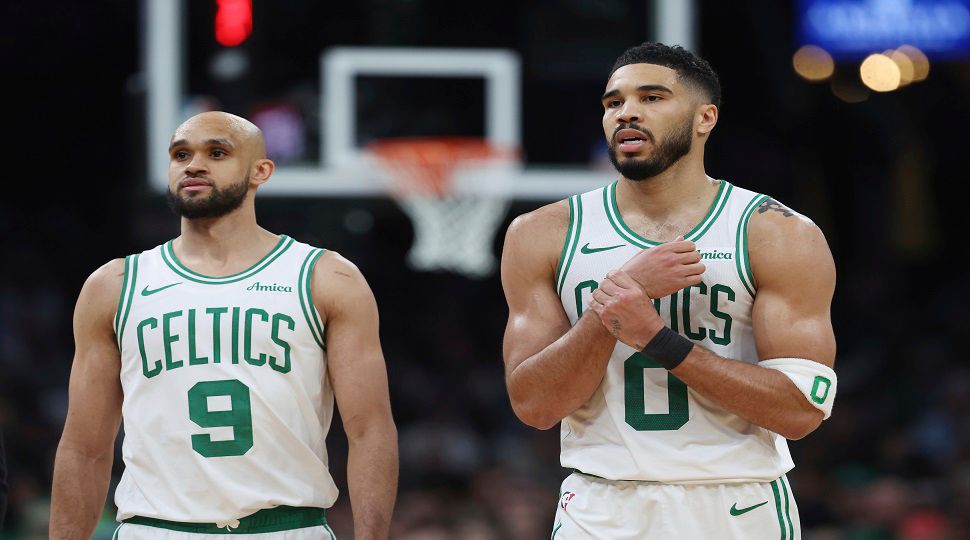 Boston Celtics' Jayson Tatum (0), right, reacts beside Derrick White after falling on a flagrant fowl by Orlando Magic's Kentavious Caldwell-Pope during the second half in Game 1 of a first-round NBA playoff basketball series Sunday, April 20, 2025, in Boston. (AP Photo/Michael Dwyer)