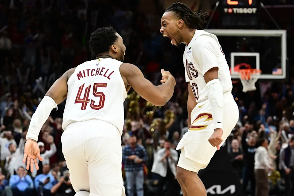 Cleveland Cavaliers guard Donovan Mitchell (45) and guard Darius Garland (10) celebrate after Mitchell made a three point basket during the second half against the Oklahoma City Thunder at Rocket Mortgage FieldHouse in Cleveland on Jan. 8, 2025.