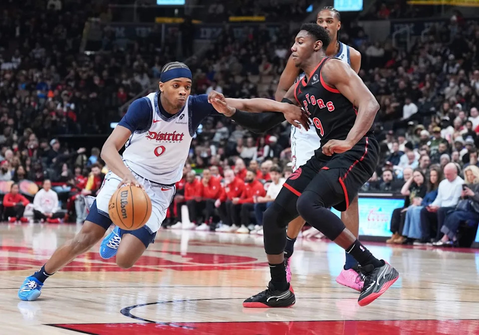 Washington Wizards guard Bilal Coulibaly (0) controls the ball as Toronto Raptors guard RJ Barrett (9)Nick Turchiaro-Imagn Images
