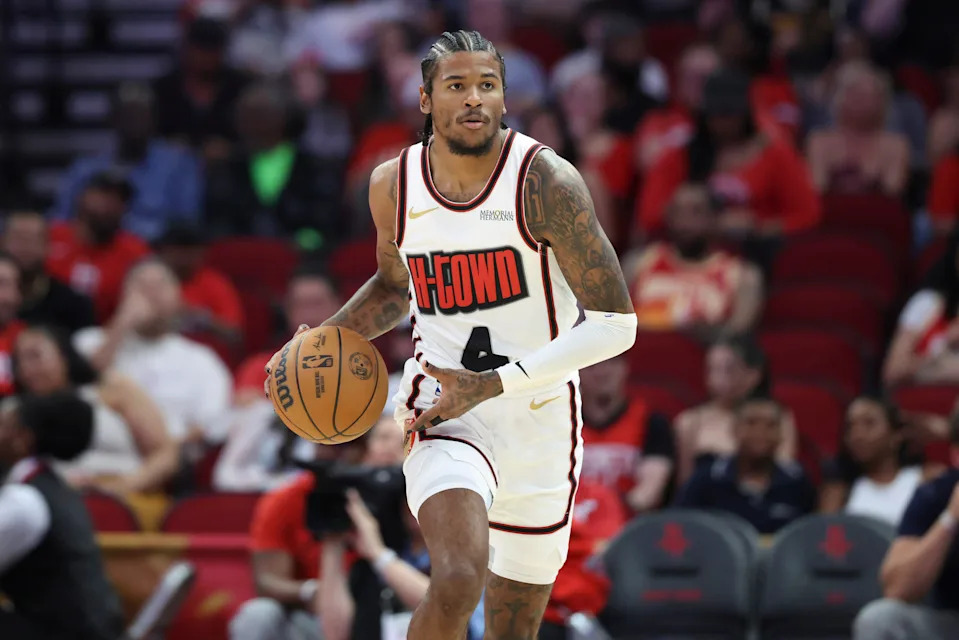 Mar 23, 2025; Houston, Texas, USA; Houston Rockets guard Jalen Green (4) brings the ball up the court during the first quarter against the Denver Nuggets at Toyota Center. Mandatory Credit: Troy Taormina-Imagn Images