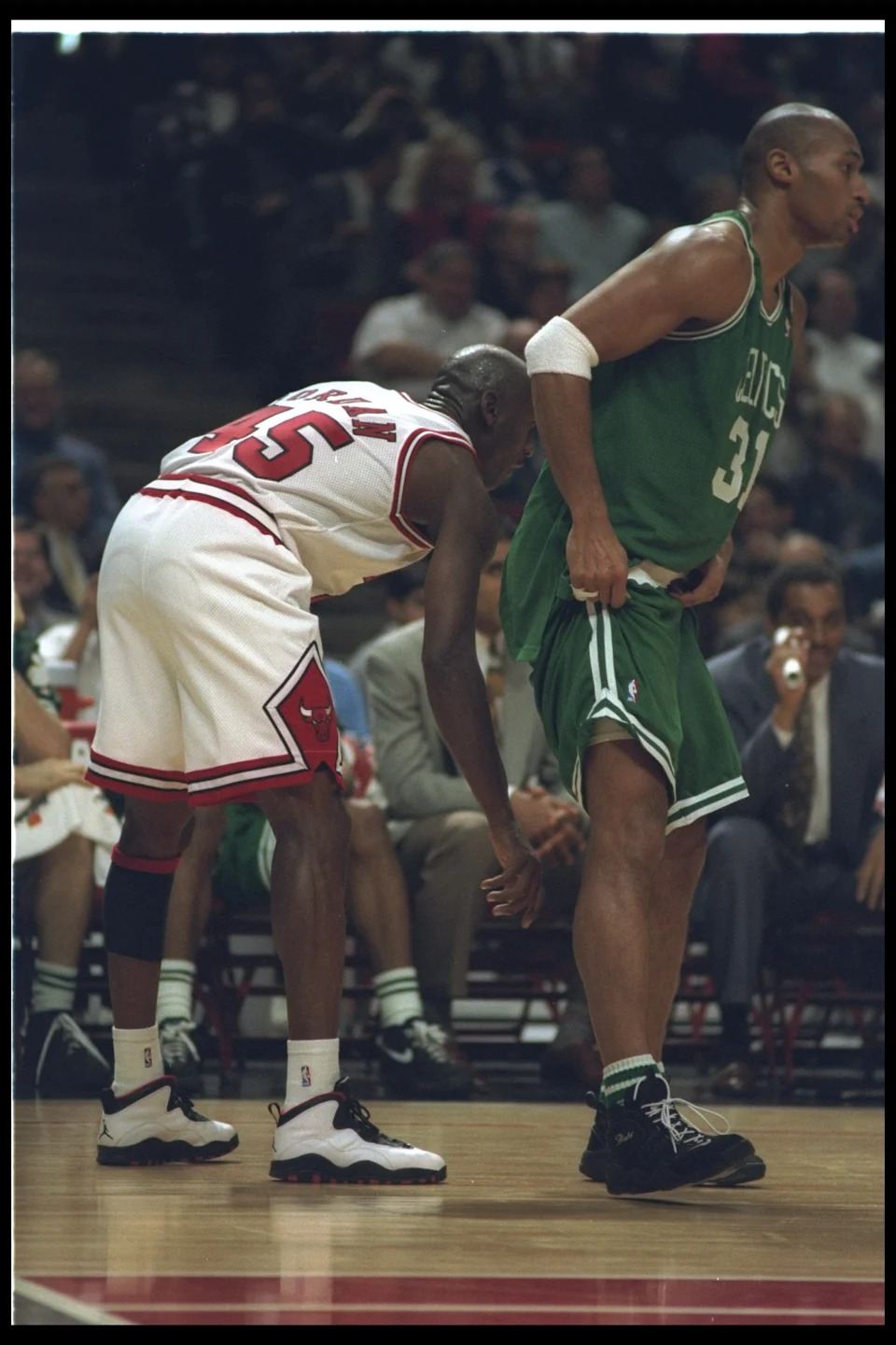 30 Mar 1995: Guard Michael Jordan of the Chicago Bulls de-shorts forward Derek Strong of the Boston Celtics during a game at the United Center in Chicago, Illinois. The Bulls won the game, 100-82. Mandatory Credit: Jonathan Daniel /Allsport