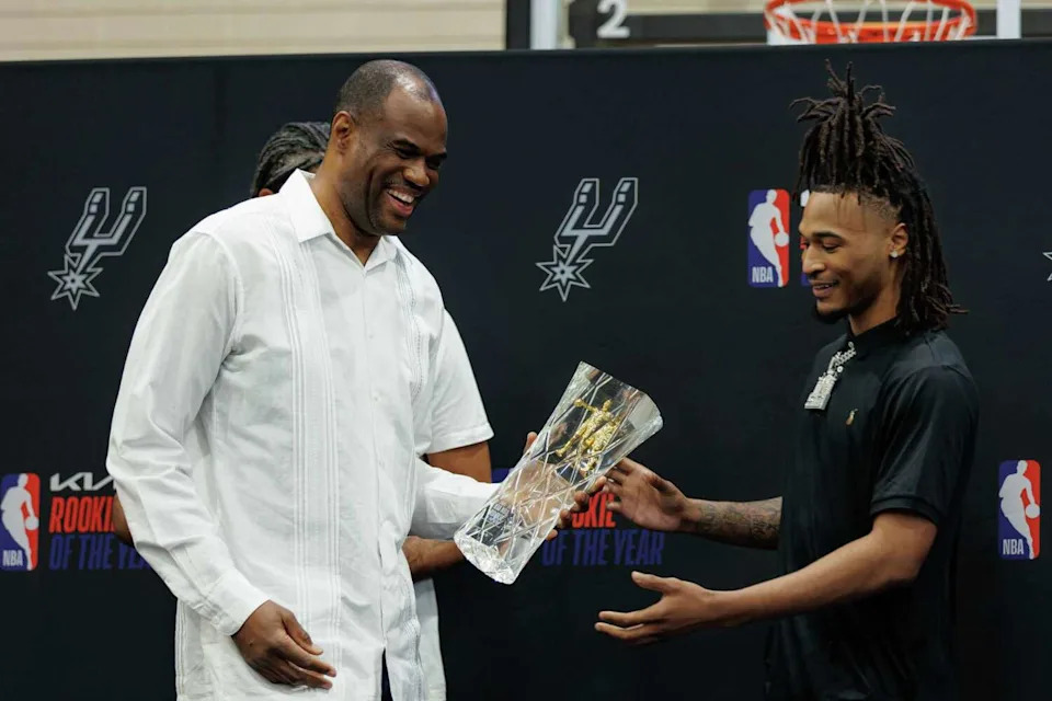Former San Antonio Spurs player David Robinson presents the 2024-2025 KIA NBA Rookie of the Year trophy to Stephon Castle during a small ceremony at Victory Capital Performance Center in San Antonio on Wednesday, April 30, 2025. (Sam Owens/San Antonio Express-News)