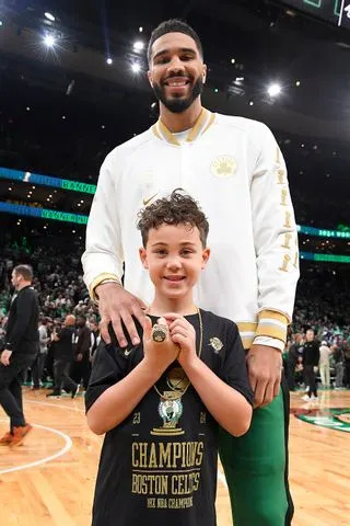 Brian Babineau/NBAE via Getty Tatum with son Deuce, 7, in October 2024