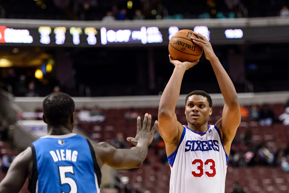 Jan 6, 2014; Philadelphia, PA, USA; Philadelphia 76ers center Daniel Orton (33) shoots a jump shot over the defense of Minnesota Timberwolves center Gorgui Dieng (5) during the fourth quarter at the Wells Fargo Center. The Timberwolves defeated the Sixers 126-95. Mandatory Credit: Howard Smith-USA TODAY Sports