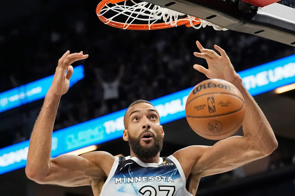 Apr 11, 2025; Minneapolis, Minnesota, USA; Minnesota Timberwolves center Rudy Gobert (27) dunks against the Brooklyn Nets in the third quarter at Target Center. Mandatory Credit: Bruce Kluckhohn-Imagn Images