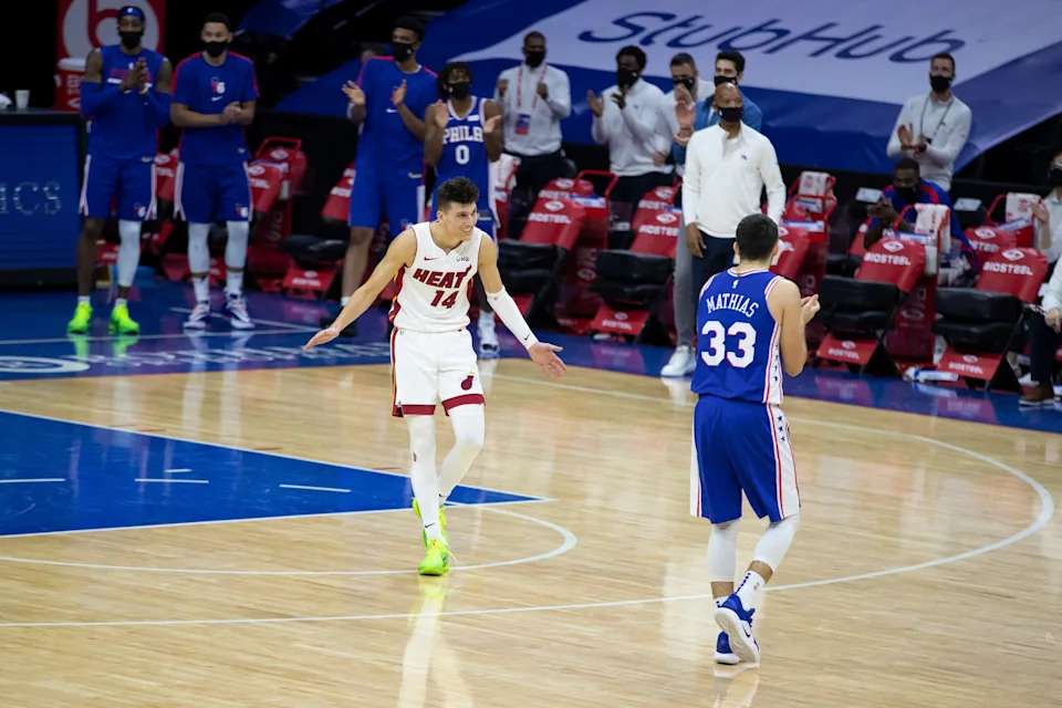 PHILADELPHIA, PA - JANUARY 12: Tyler Herro #14 of the Miami Heat and Dakota Mathias #33 of the Philadelphia 76ers react in overtime at the Wells Fargo Center on January 12, 2021 in Philadelphia, Pennsylvania. The 76ers defeated the Heat 137-134. NOTE TO USER: User expressly acknowledges and agrees that, by downloading and or using this photograph, User is consenting to the terms and conditions of the Getty Images License Agreement. (Photo by Mitchell Leff/Getty Images)