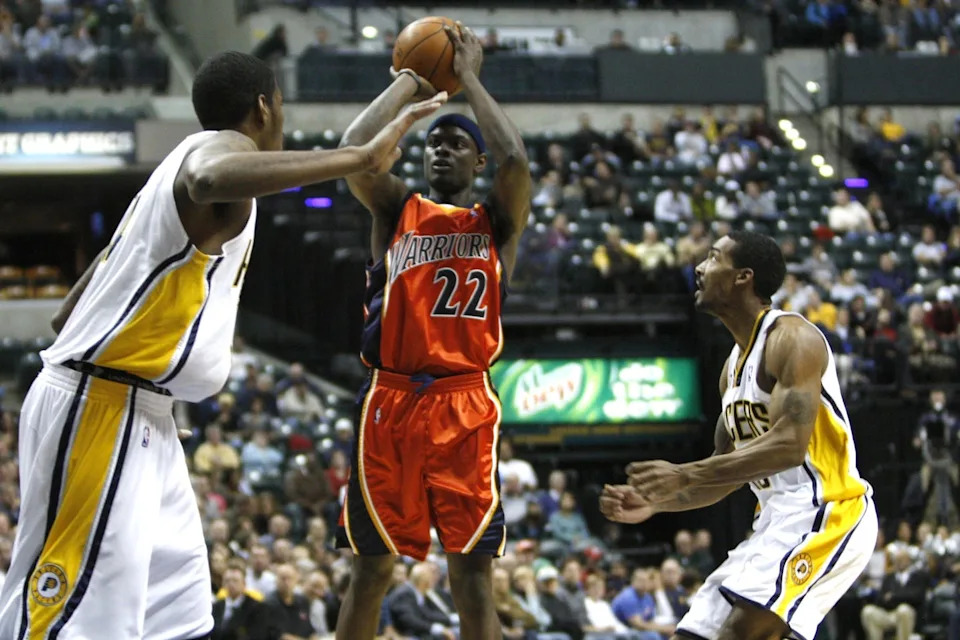 Nov 11, 2009; Indianapolis, IN, USA; Golden State Warriors guard Anthony Morrow (22) shoots while being covered by the Indiana Pacers forward Danny Granger (33) guard Luther Head (13) in the first half at Conseco Fieldhouse . Mandatory Credit: Frank Victores-USA TODAY Sports