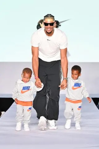 Slaven Vlasic/Getty Josh Hart walks the New York Fashion Week Runway with his twins.