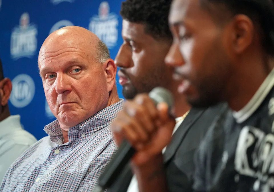 LOS ANGELES, CA - JULY 24: Clippers owner Steve Ballmer, left, looks on at his new players Paul George and Kawhi Leonard, right, during a press conference at the Green Meadows Recreation Center in Los Angeles on Wednesday, July 24, 2019. George and Leonard were introduced to the media and fans as the newest members of the Clippers. (Photo by Scott Varley/MediaNews Group/Daily Breeze via Getty Images)