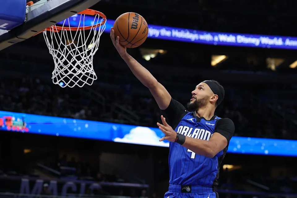 Dec 23, 2024; Orlando, Florida, USA; Orlando Magic guard Jalen Suggs (4) drives to the basket against the Boston Celtics in the third quarter at Kia Center. Mandatory Credit: Nathan Ray Seebeck-Imagn Images