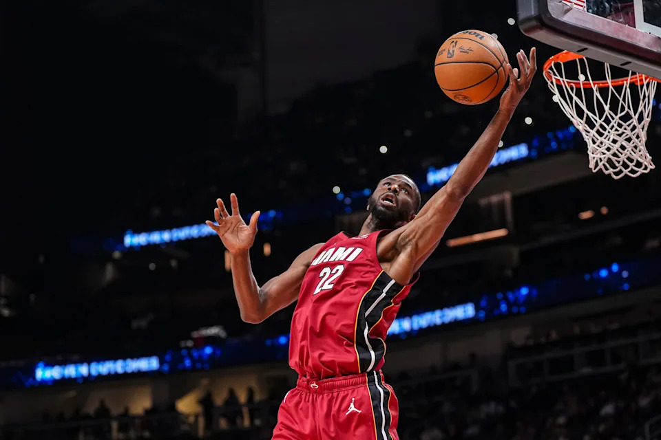 Feb 24, 2025; Atlanta, Georgia, USA; Miami Heat forward Andrew Wiggins (22) reaches for a rebound against the Atlanta Hawks during the first half at State Farm Arena. Mandatory Credit: Dale Zanine-Imagn Images