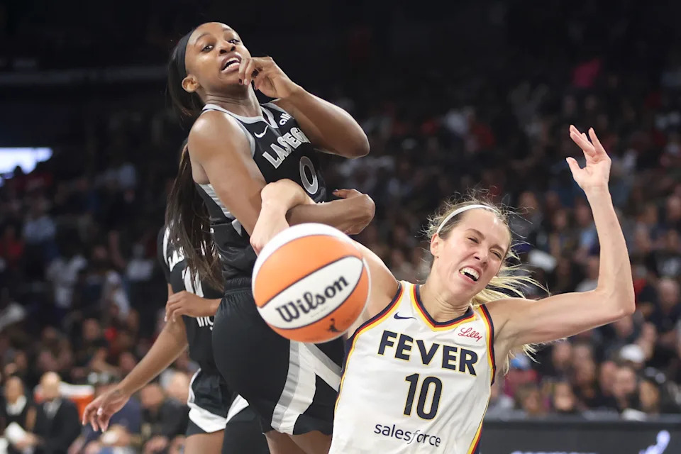 LAS VEGAS, NEVADA - SEPTEMBER 23: Jackie Young #0 of the Las Vegas Aces and Lexie Hull #10 of the Indiana Fever get tangled up while contesting for a rebound in the fourth quarter of a game of Game Two of the 2025 WNBA Playoffs semifinals at Michelob ULTRA Arena on September 23, 2025 in Las Vegas, Nevada. NOTE TO USER: User expressly acknowledges and agrees that, by downloading and or using this photograph, User is consenting to the terms and conditions of the Getty Images License Agreement. (Photo by Ian Maule/Getty Images)