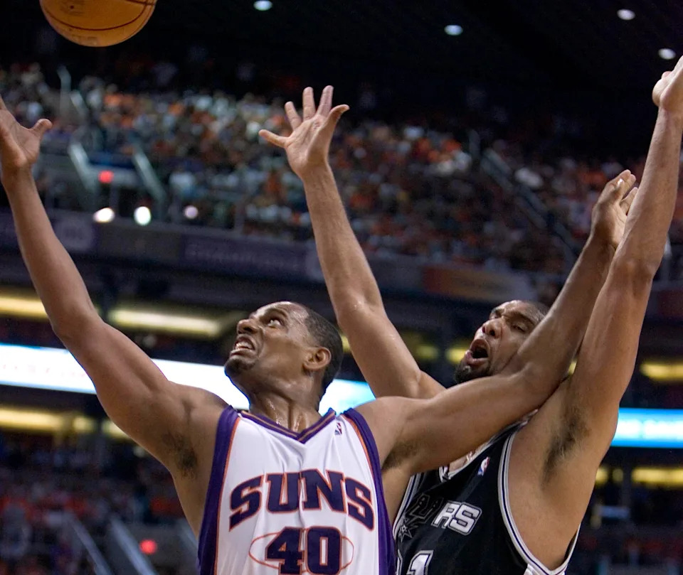 Kurt Thomas of the Suns rebounds the ball against Tim Duncan of the Spurs during the third quarter of Game 5 of the the second round of the NBA Playoffs on May 16, 2007, in Phoenix.