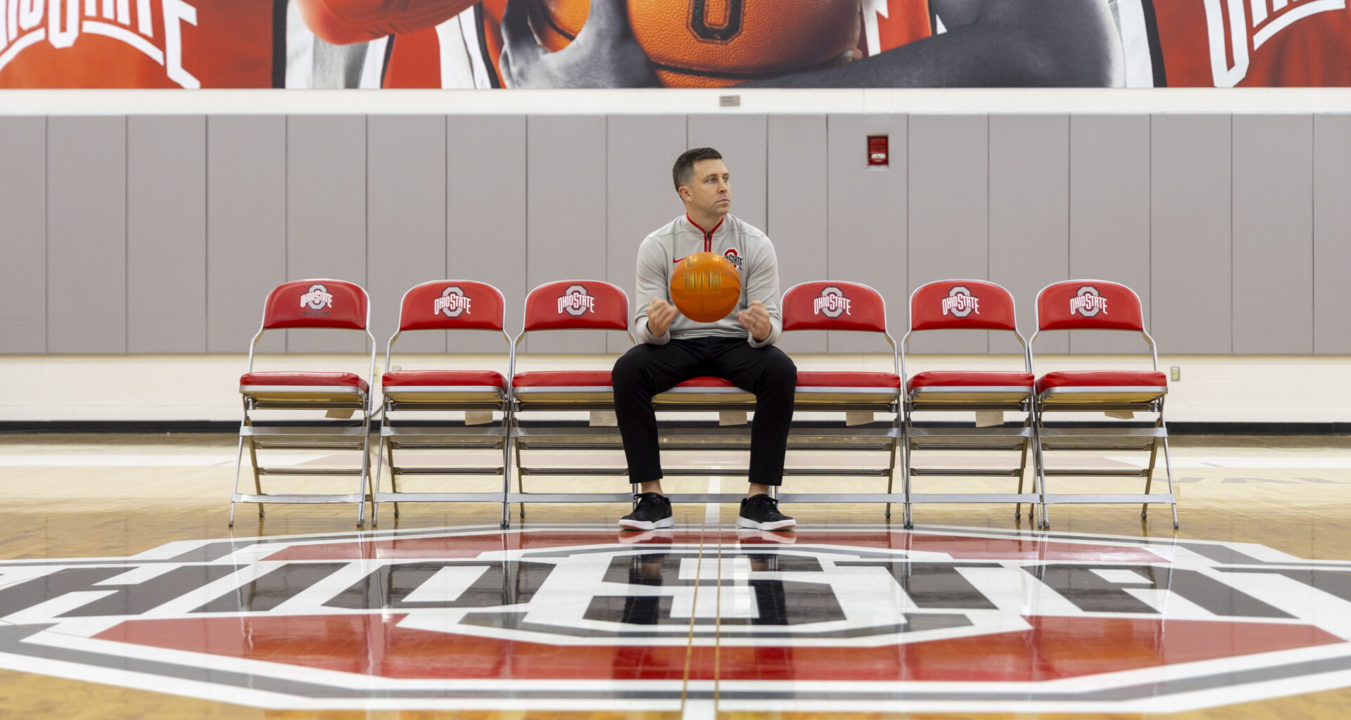 Ohio State head coach Jake Diebler spinning a basketball before speaking with media Oct. 9, 2024. Ohio State inked a four-year deal Monday to join the Players Era Festival. Credit: Sandra Fu