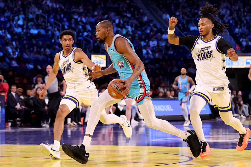 Kevin Durant #35 of the Phoenix Suns and Shaq's OGs drives to the basket against Ryan Dunn #0 of the Phoenix Suns and Candace's Rising Stars and Stephon Castle #5 of the San Antonio Spurs and Candace's Rising Stars during the 74th NBA All-Star Game at Chase Center on February 16, 2025, in San Francisco.