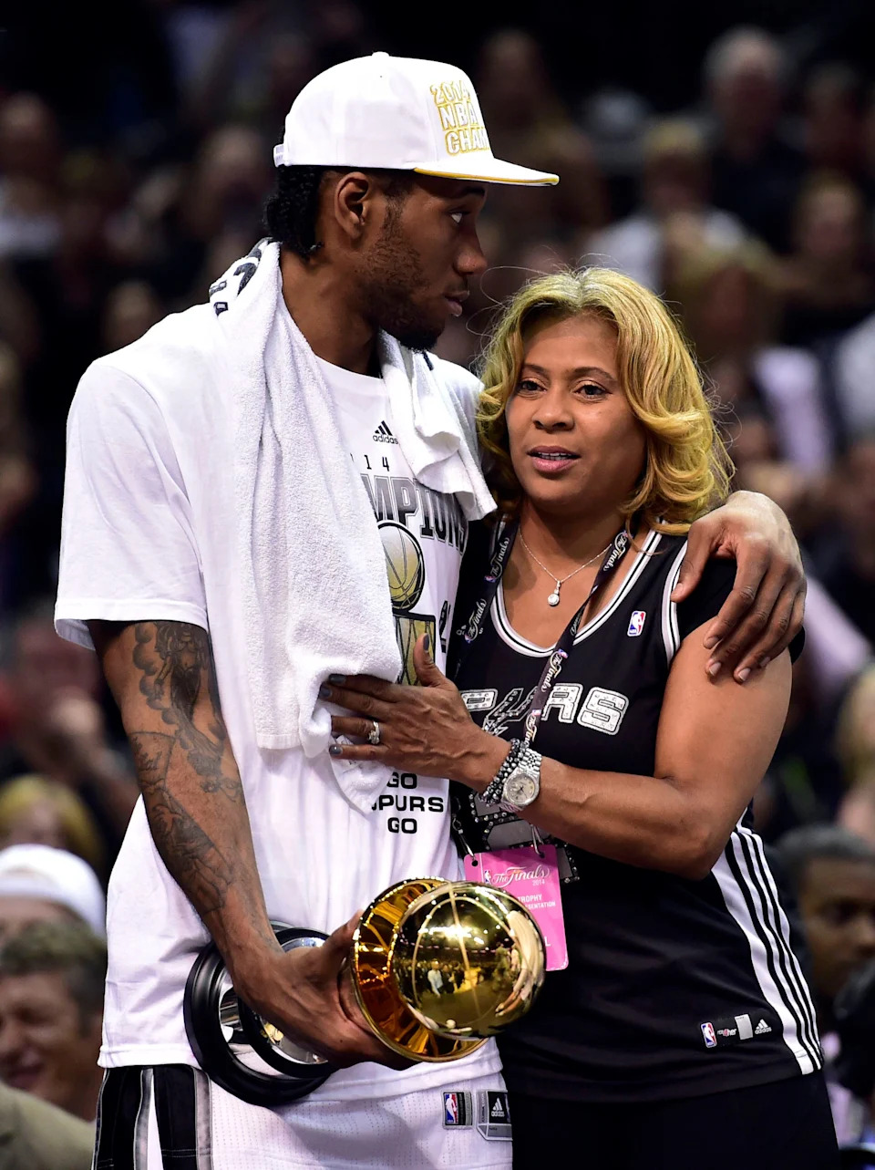 Kawhi Leonard hugs his mother Kim Robertson after being named NBA Finals MVP when the San Antonio Spurs won the NBA championship on June 15, 2014.