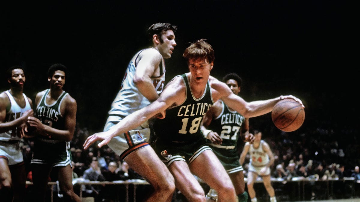 Dave Cowens traded; center Steve Downing born