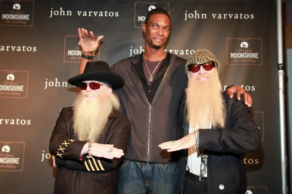 Bosh, seen here with Dusty Hill (left) and Billy Gibbons (right) of ZZ Top, is facing allegations in civil court from his former personal assistant, who claims working for him and wife Adrienne left her with debilitating panic attacks (Getty Images)