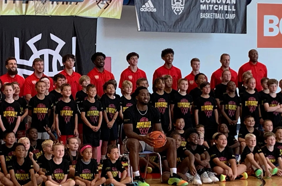 Mitchell poses for a group photo with the campers.