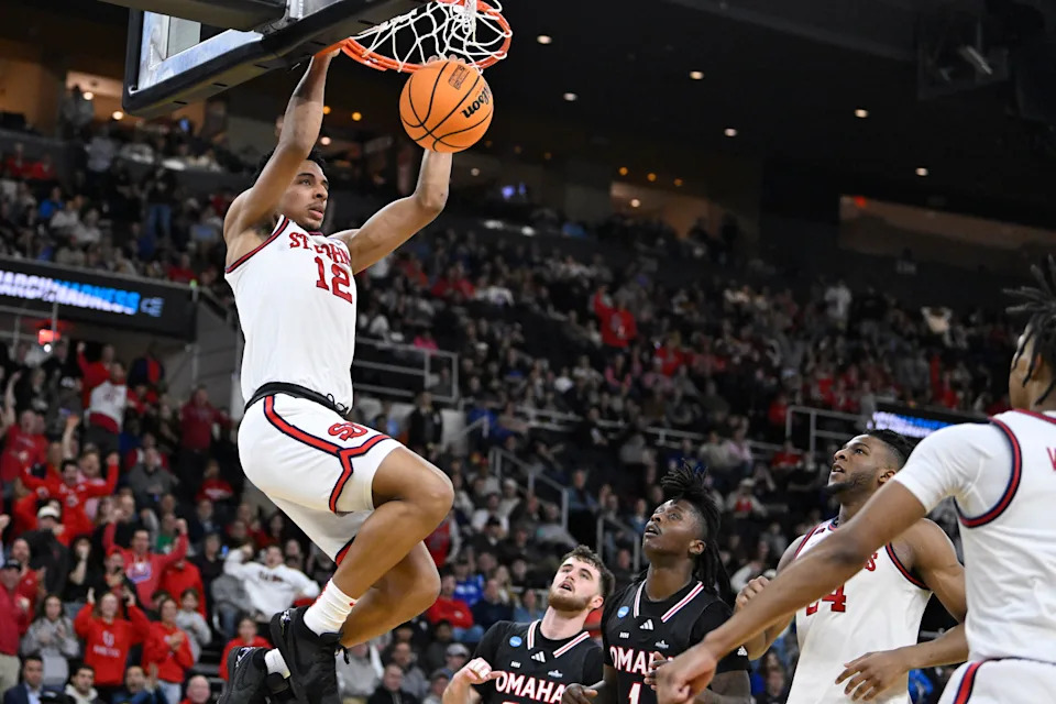 Mar 20, 2025; Providence, RI, USA; St. John's Red Storm guard RJ Luis Jr. (12) puts up a basket during the second half against the Omaha Mavericks at Amica Mutual Pavilion. Mandatory Credit: Eric Canha-Imagn Images