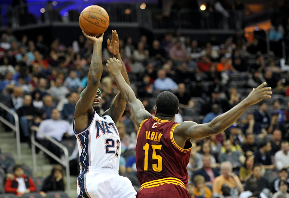 Apr 8, 2012; Newark, NJ, USA; New Jersey Nets guard Anthony Morrow (22) takes a fade away jump shot over Cleveland Cavaliers guard Donald Sloan (15) during the first half at the Prudential Center. Mandatory Credit: Joe Camporeale-USA TODAY Sports