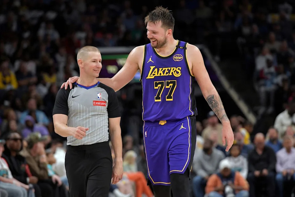 Los Angeles Lakers guard Luka Doncic (77) talks with referee Tyler Ford in the second half of an NBA basketball game against Memphis Grizzlies on Saturday, March 29, 2025, in Memphis, Tenn. AP