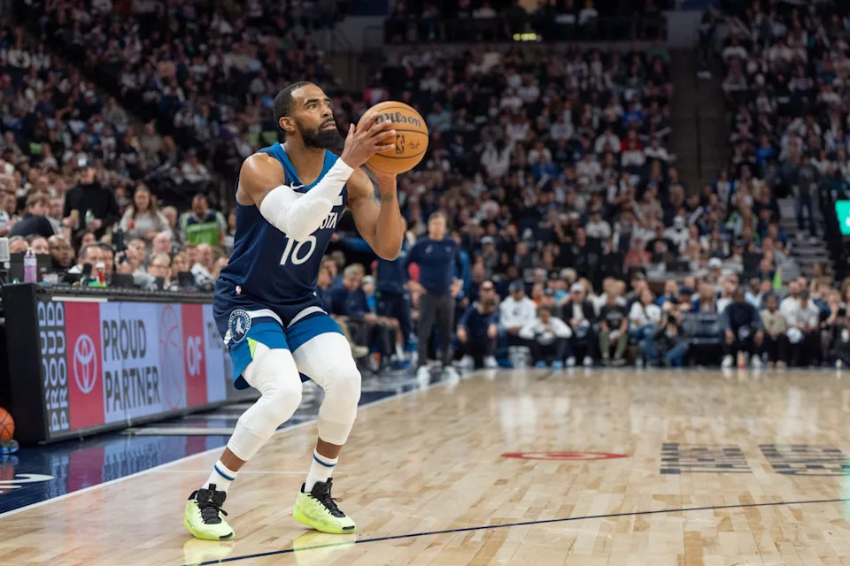 Apr 13, 2025; Minneapolis, Minnesota, USA; Minnesota Timberwolves guard Mike Conley (10) shoots a three-point shot against the Utah Jazz in the second quarter at Target Center. Mandatory Credit: Matt Blewett-Imagn Images