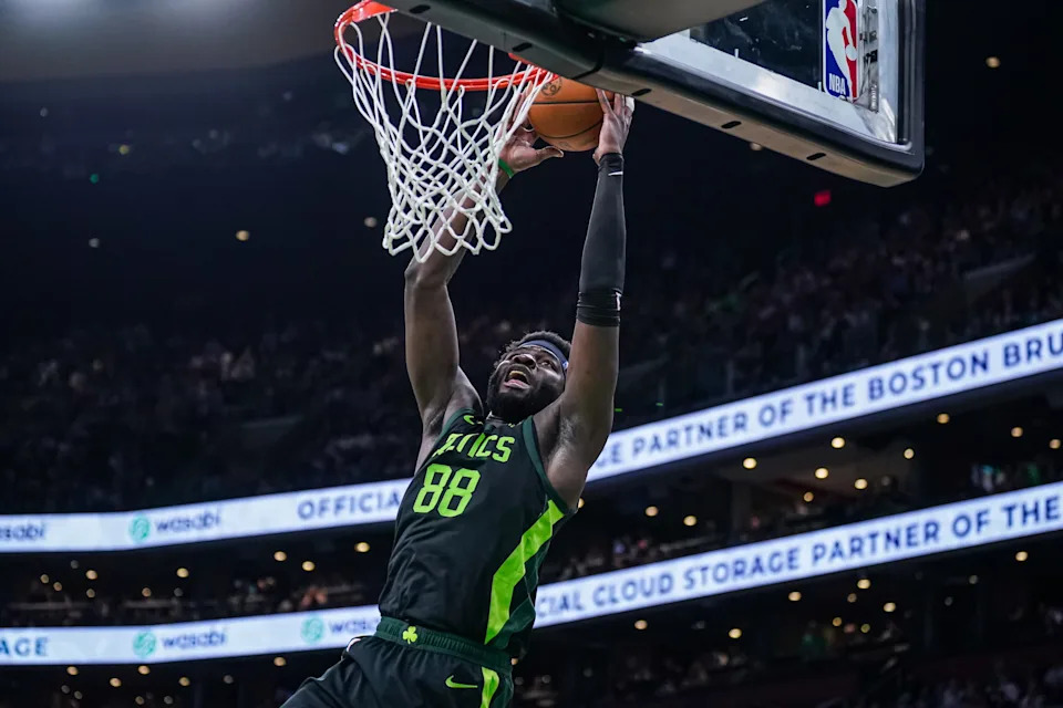 Mar 6, 2025; Boston, Massachusetts, USA; Boston Celtics center Neemias Queta (88) makes the basket against the Philadelphia 76ers in the second half at TD Garden. Mandatory Credit: David Butler II-Imagn Images