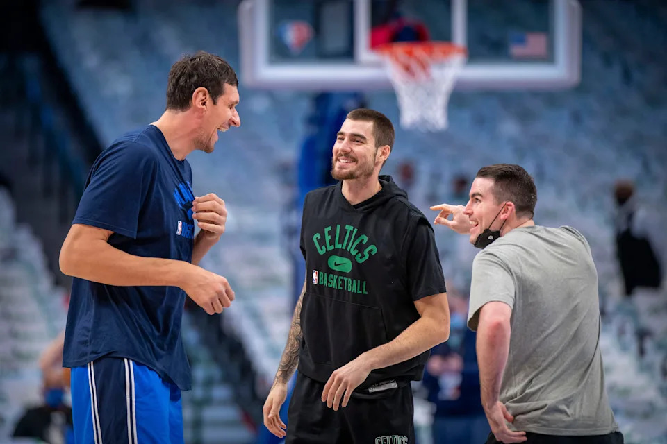 Nov 6, 2021; Dallas, Texas, USA; Dallas Mavericks center Boban Marjanovic (left) jokes with Boston Celtics forward Juancho Hernangomez (center) before the game at the American Airlines Center. Mandatory Credit: Jerome Miron-USA TODAY Sports
