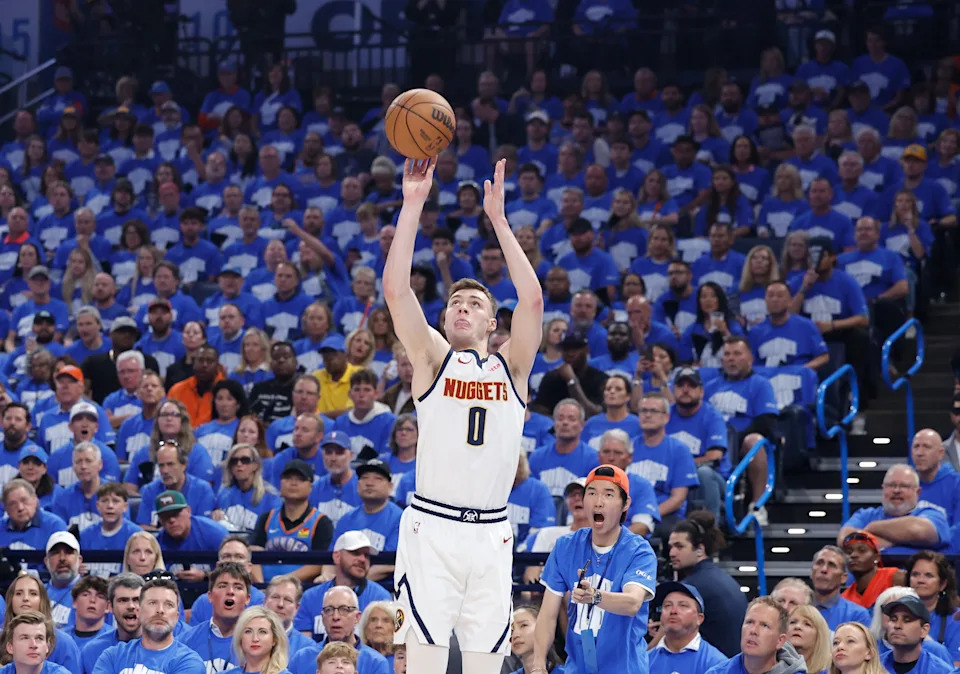 May 18, 2025; Oklahoma City, Oklahoma, USA; Denver Nuggets guard Christian Braun (0) shoots a three point basket against the Oklahoma City Thunder in the first quarter during game seven of the second round for the 2025 NBA Playoffs at Paycom Center. Mandatory Credit: Alonzo Adams-Imagn Images
